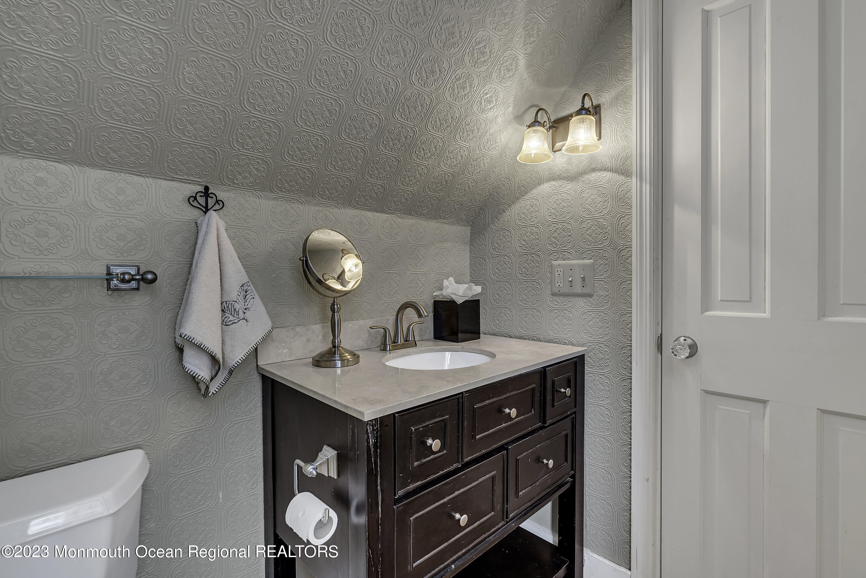 424 Mercer Avenue Spring Lake, NJ 07762 - Photo 32 of 36 a bathroom with a sink vanity and a mirror