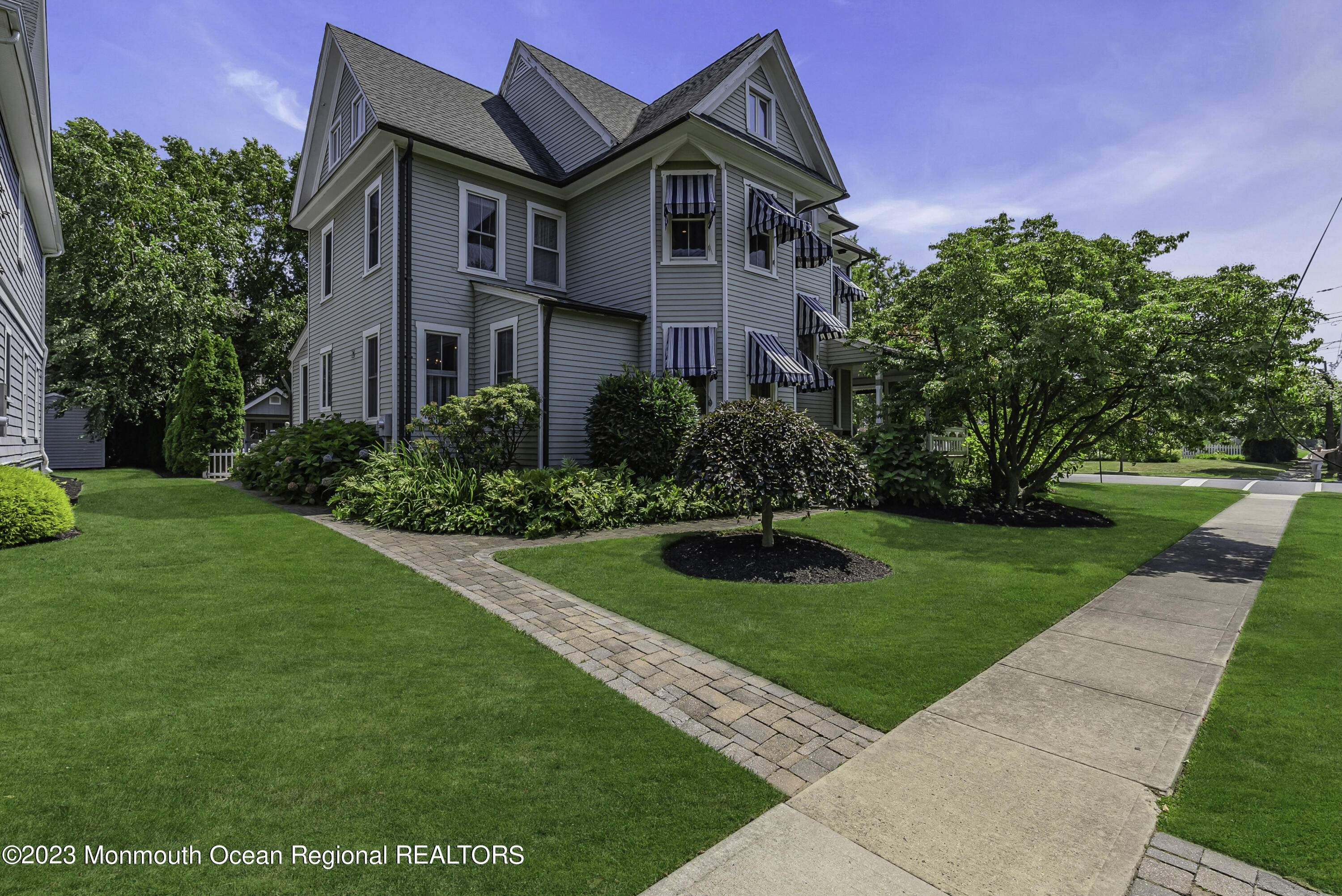 424 Mercer Avenue Spring Lake, NJ 07762 - Photo 7 of 36 a front view of a house with a yard