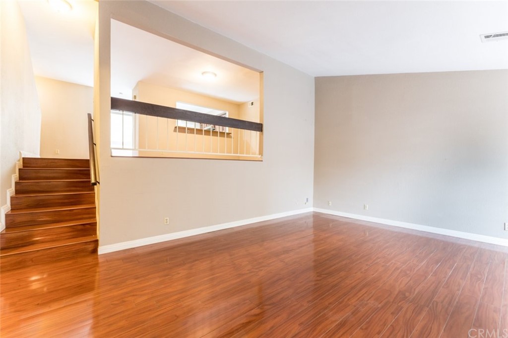 a view of an entryway with wooden floor