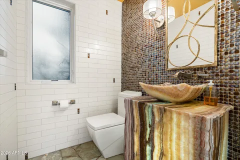 a bathroom with a toilet and a sink