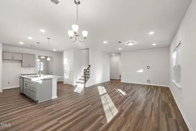 a view of kitchen with cabinets and wooden floor