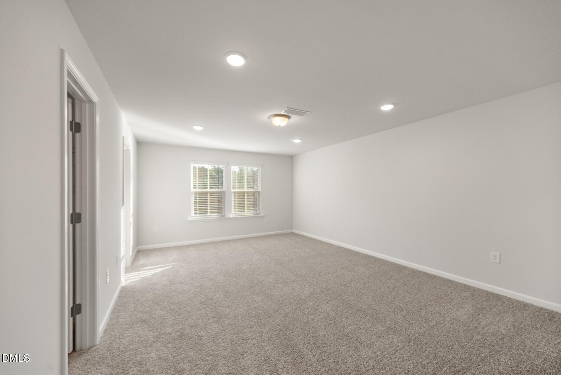 232 Bridle Brk Way Fuquay-Varina, NC 27526 - Photo 16 of 28 a view of an empty room with a window