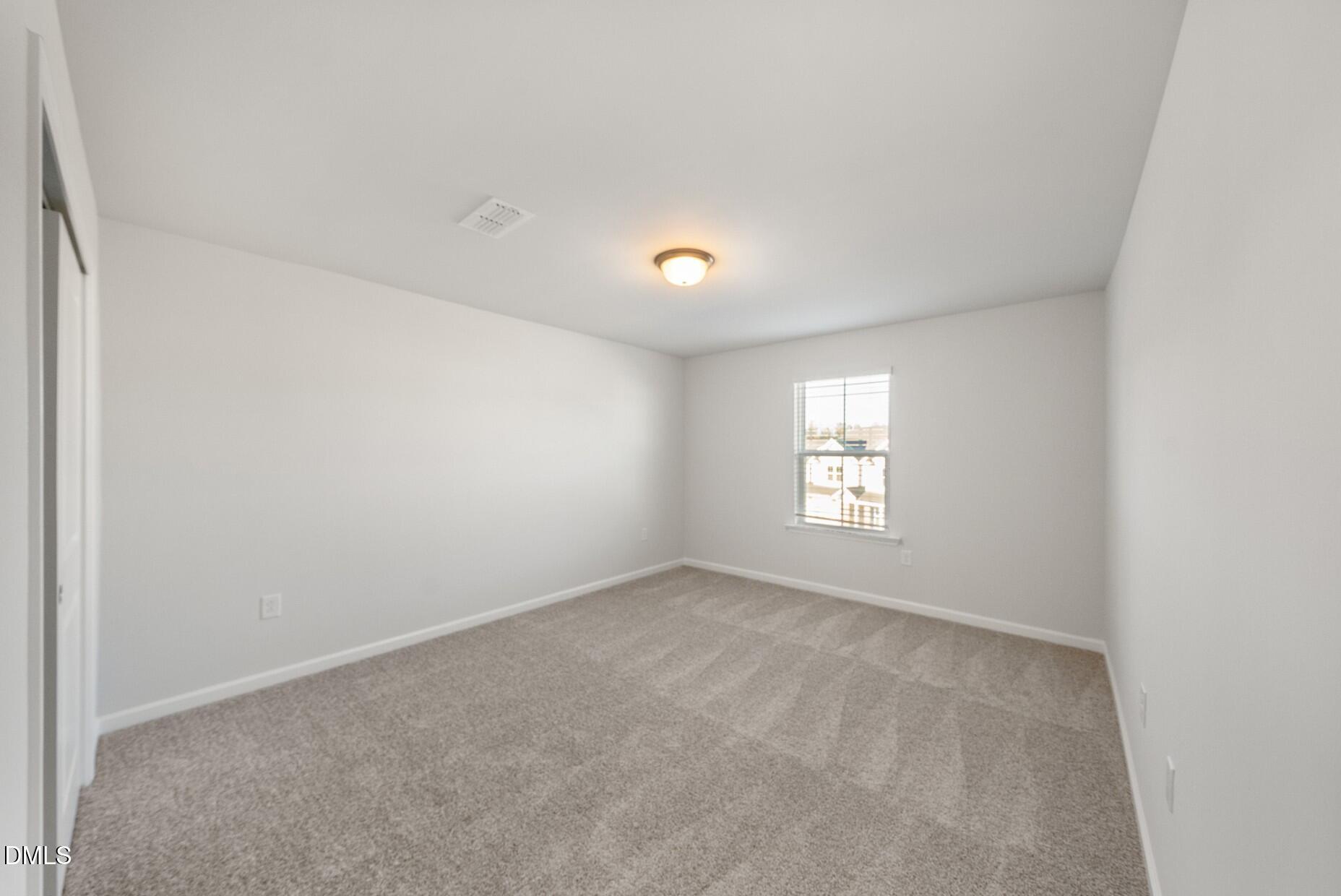 232 Bridle Brk Way Fuquay-Varina, NC 27526 - Photo 21 of 28 a view of an empty room with a window