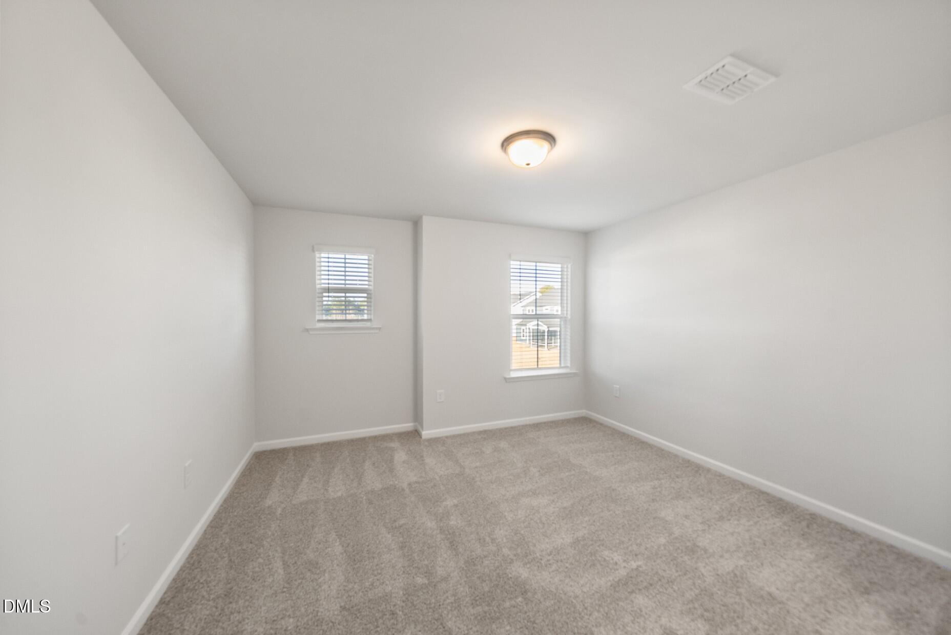 232 Bridle Brk Way Fuquay-Varina, NC 27526 - Photo 22 of 28 an empty room with windows