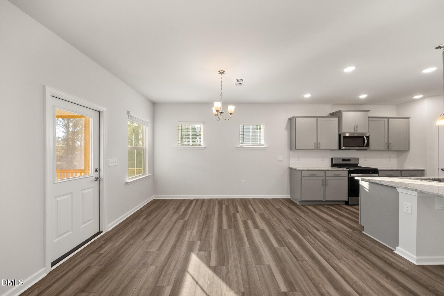 232 Bridle Brk Way Fuquay-Varina, NC 27526 - Photo 7 of 28 a view of kitchen with sink microwave refrigerator and stove