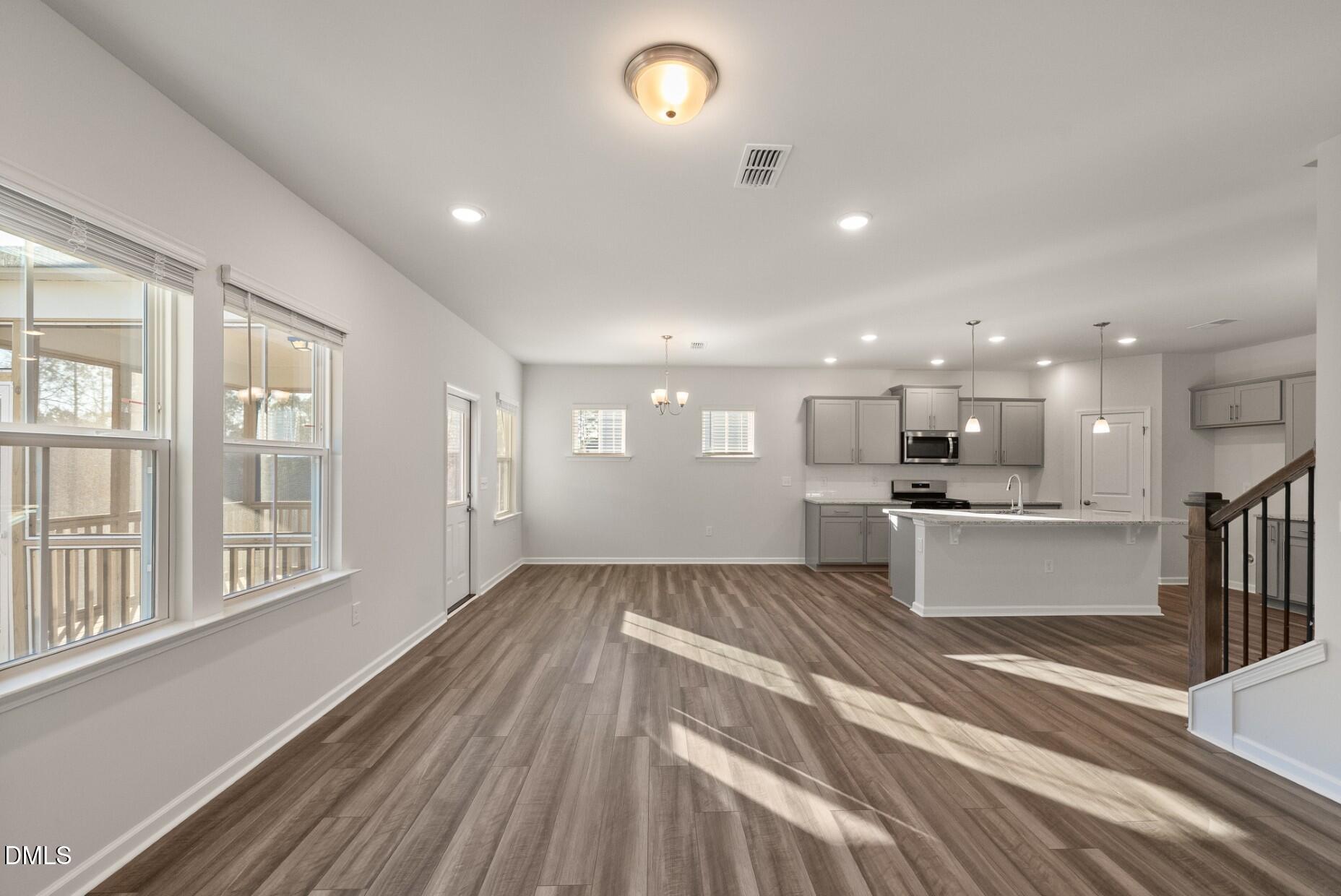 232 Bridle Brk Way Fuquay-Varina, NC 27526 - Photo 9 of 28 a view of kitchen with cabinets and wooden floor
