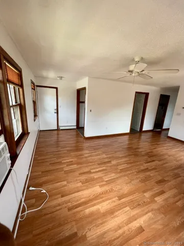 a view of a livingroom with wooden floor