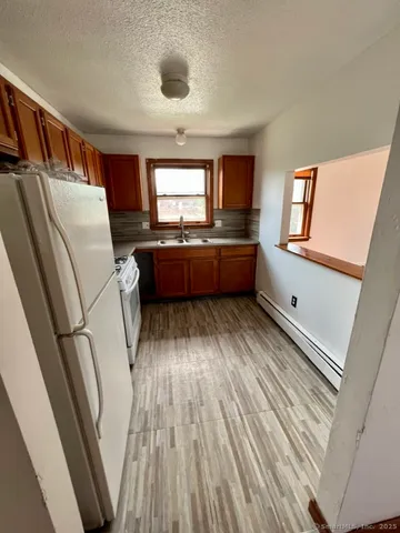 a room with window wooden floor and furniture