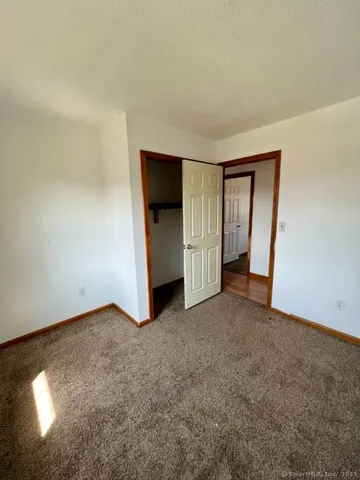 an empty room with a bathroom