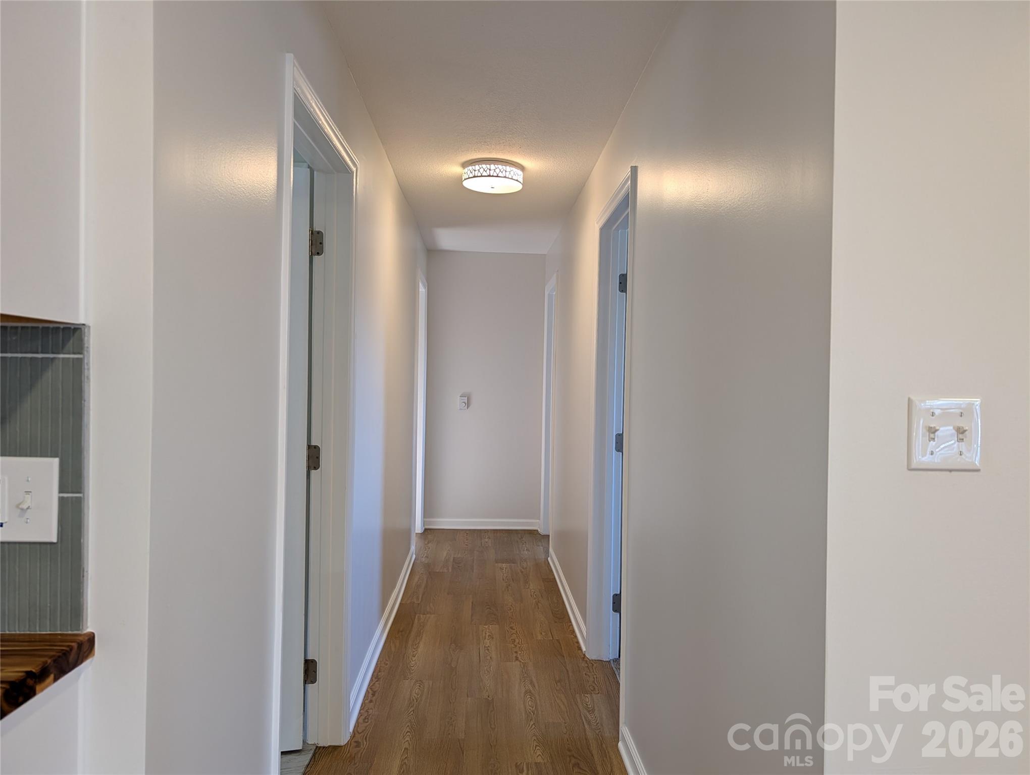 945 Summers Road Valdese, NC 28690 - Photo 12 of 25 a view of a hallway with wooden floor