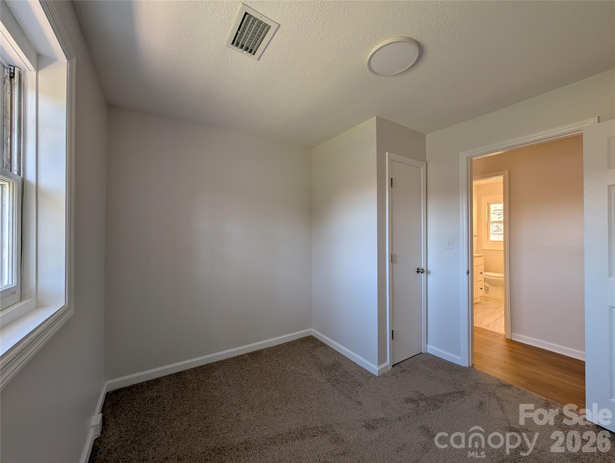 945 Summers Road Valdese, NC 28690 - Photo 17 of 25 an empty room with windows
