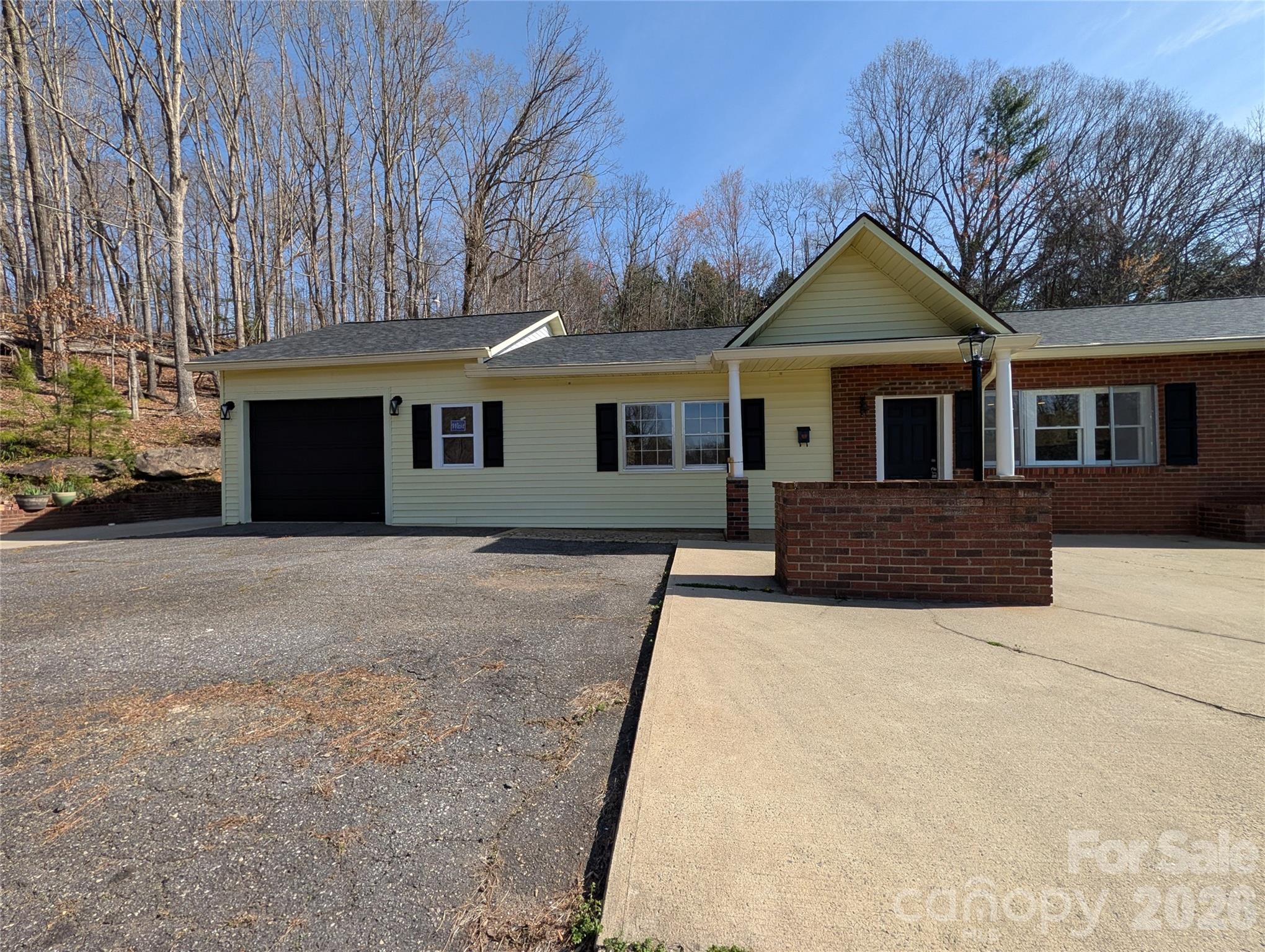 945 Summers Road Valdese, NC 28690 - Photo 25 of 25 a front view of a house with a yard and garage