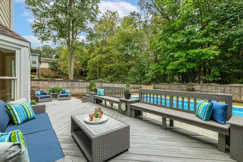 a view of a roof deck with couches and potted plants