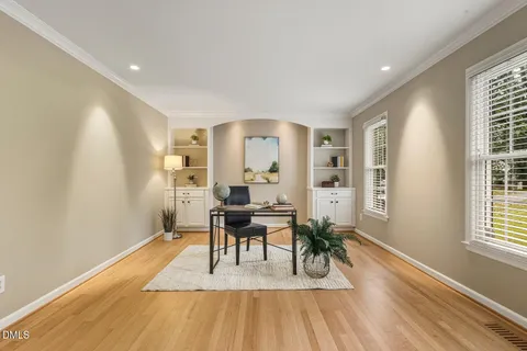 a view of a livingroom with furniture wooden floor and a window