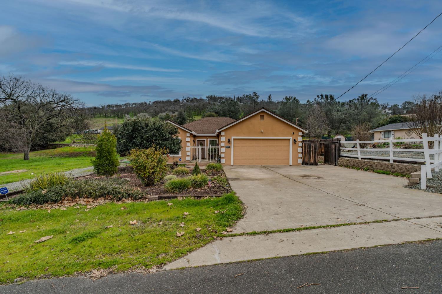 a view of house with outdoor space and street view