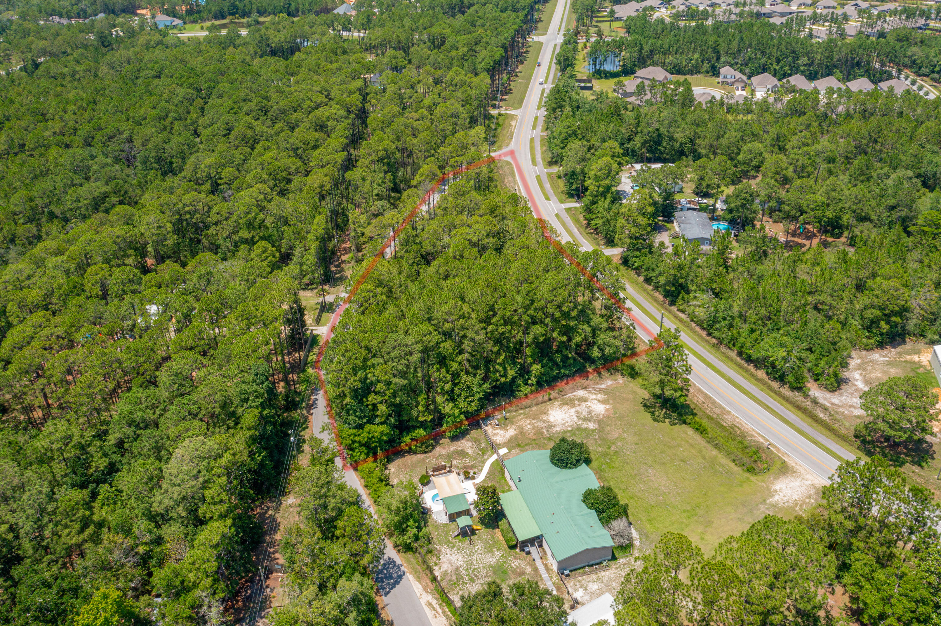 83a Freeport Freeport, FL 32439 - Photo 6 of 16 an aerial view of residential houses with outdoor space and trees