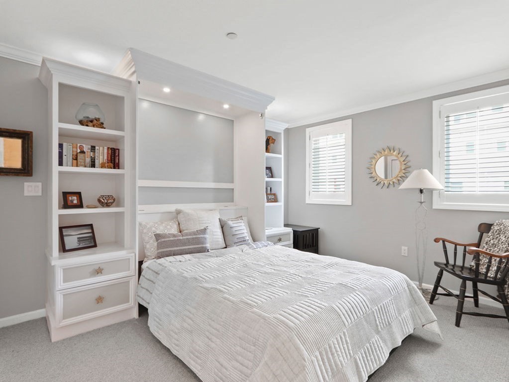 64 Constitution Road, Unit 64 Boston, MA 02129 - Photo 13 of 18 a bedroom with a large bed and a window