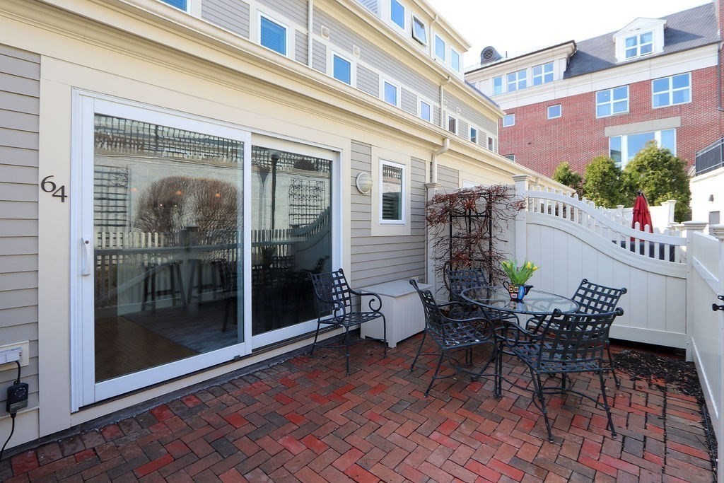 64 Constitution Road, Unit 64 Boston, MA 02129 - Photo 16 of 18 a view of a building with a table and chairs