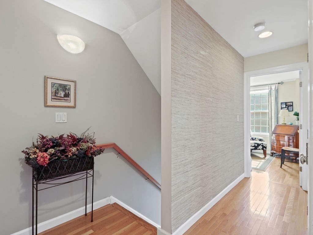 64 Constitution Road, Unit 64 Boston, MA 02129 - Photo 7 of 18 a view of a hallway to a livingroom with furniture