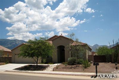 15042 North Pelham Road Tucson, AZ 85739 - Photo 1 of 10 a front view of a house with garden
