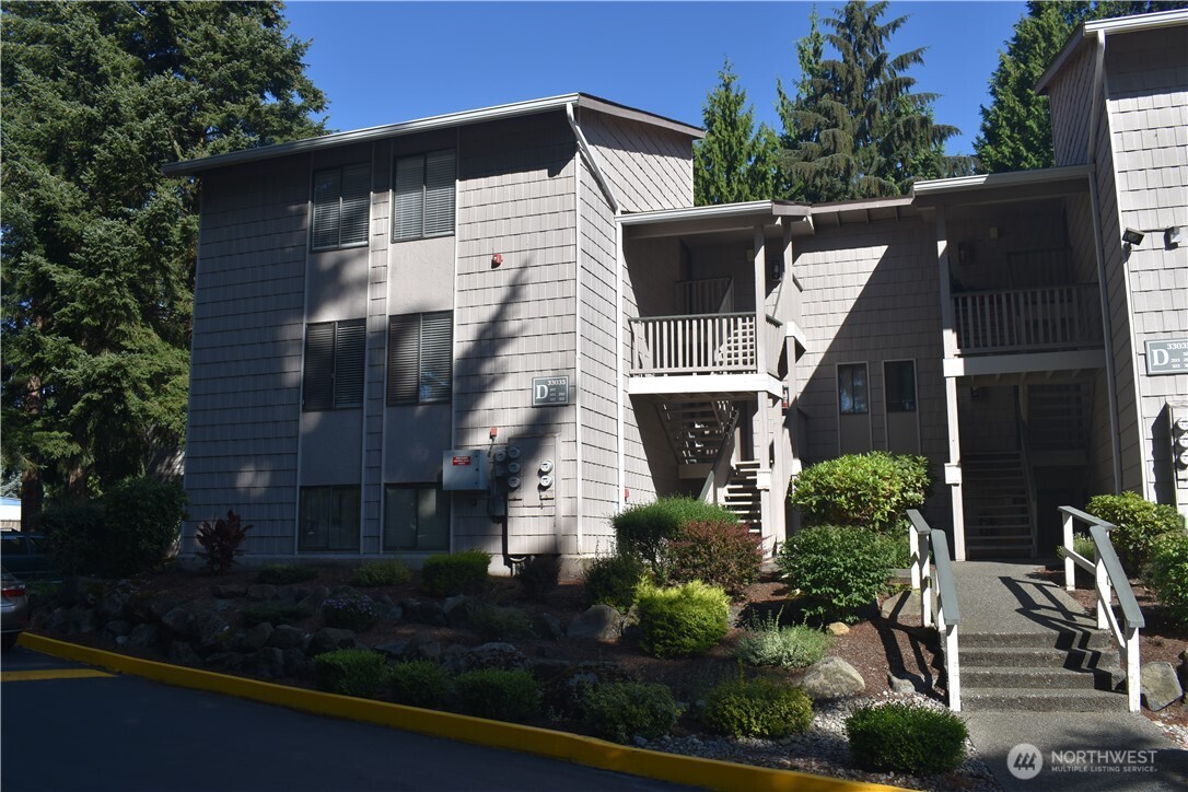 33035 18th Place South Federal Way, WA 98003 - Photo 1 of 21 a view of a house with brick walls and potted plants