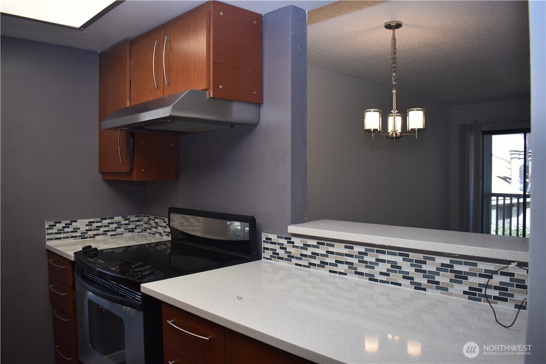 33035 18th Place South Federal Way, WA 98003 - Photo 6 of 21 a kitchen with a stove and a window