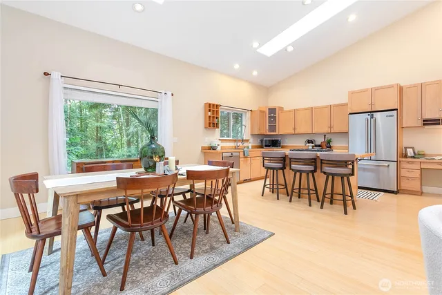 a view of a dining room with furniture and a table