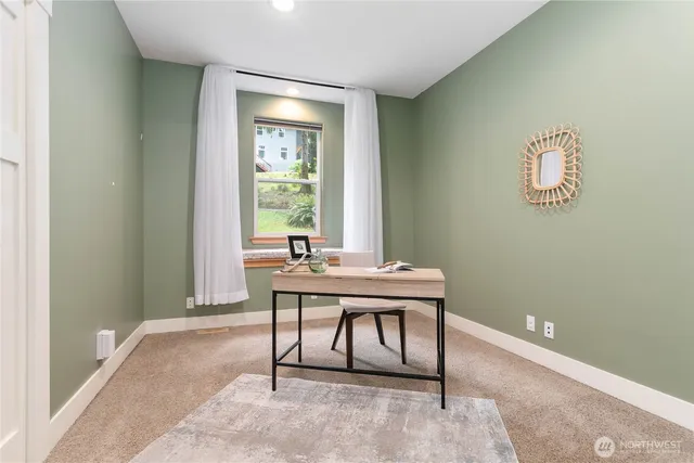 a view of a workspace with furniture