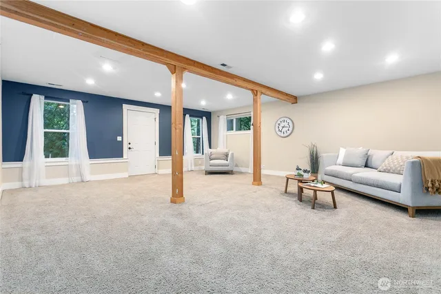 a view of a livingroom with furniture and a window