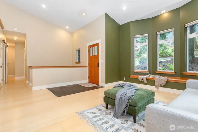 a spacious bedroom with a large bed and a couch