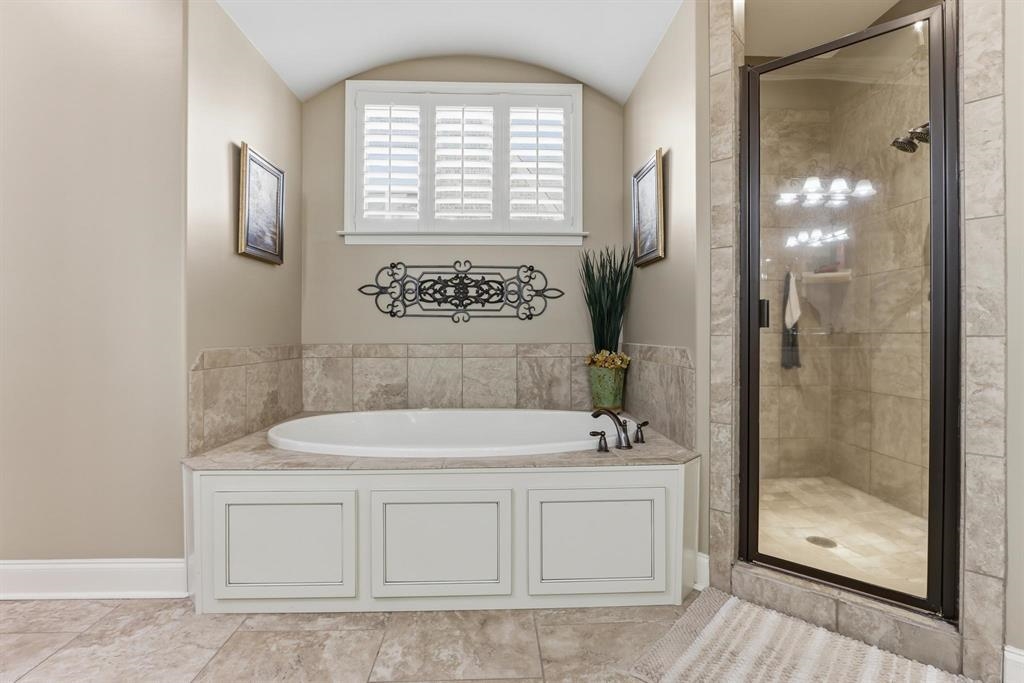 1301 Conser Street Collierville, TN 38017 - Photo 19 of 39 a bathroom with a sink a toilet and shower