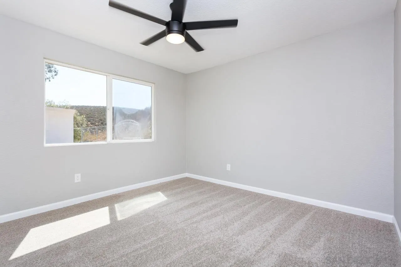 11834 Rocoso Road Lakeside, CA 92040 - Photo 23 of 28 an empty room with a window
