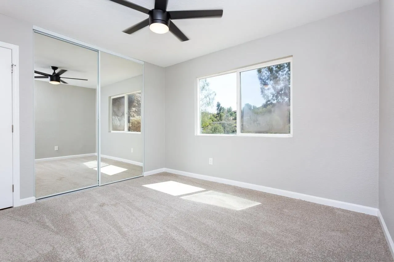 11834 Rocoso Road Lakeside, CA 92040 - Photo 24 of 28 wooden floor in an empty room with a window