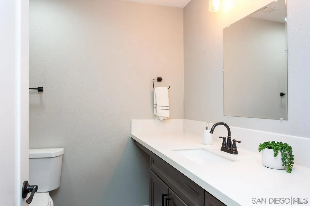 11834 Rocoso Road Lakeside, CA 92040 - Photo 25 of 28 a bathroom with a sink and a toilet