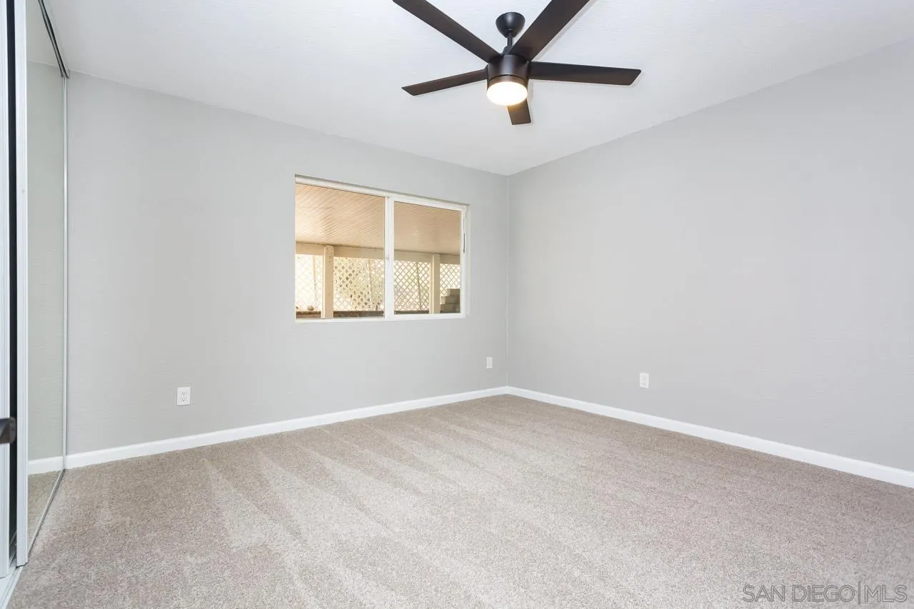 11834 Rocoso Road Lakeside, CA 92040 - Photo 27 of 28 an empty room with a window and a fan