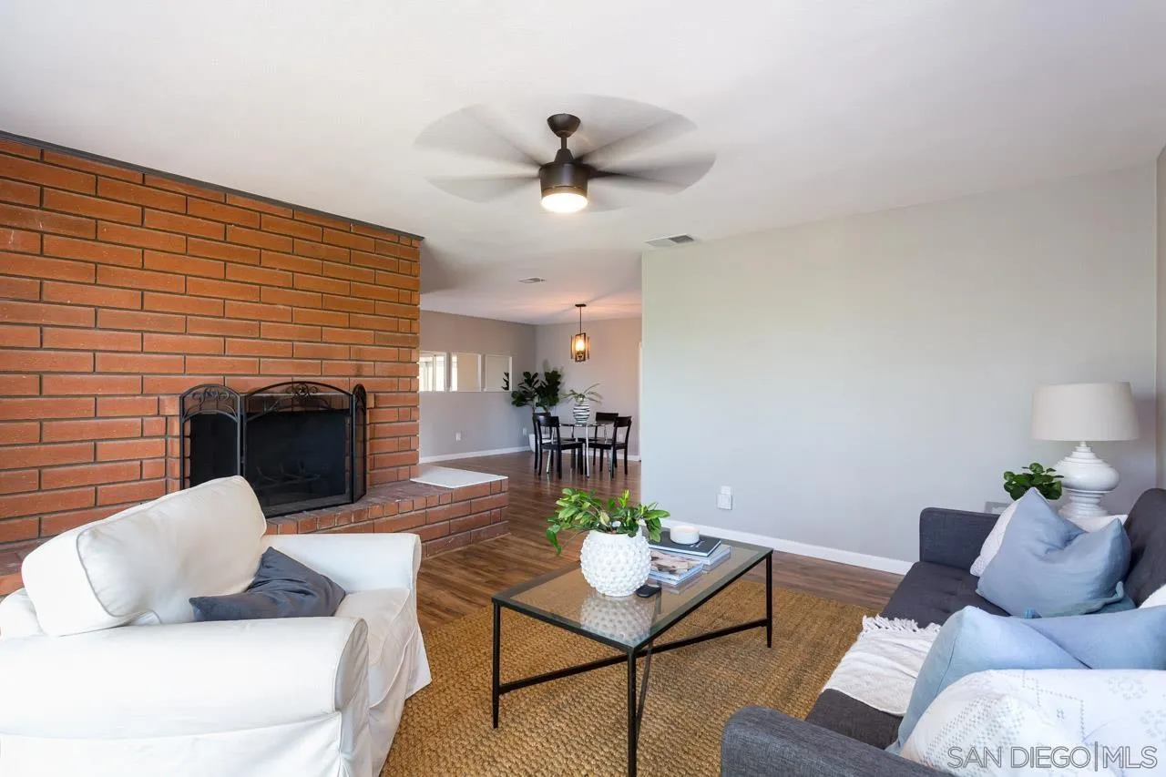 11834 Rocoso Road Lakeside, CA 92040 - Photo 6 of 28 a living room with furniture and a fireplace