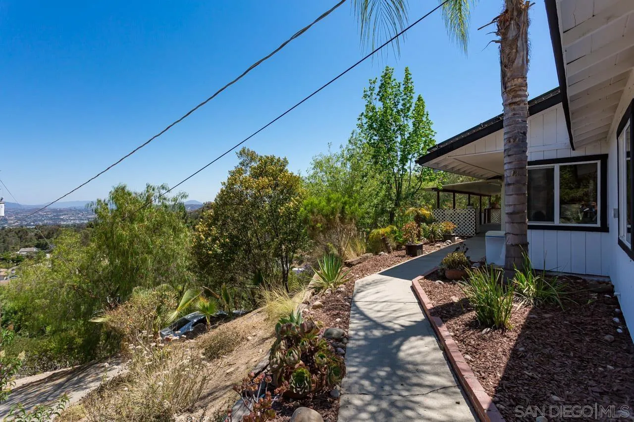 11834 Rocoso Road Lakeside, CA 92040 - Photo 8 of 28 a backyard of a house with a yard and outdoor seating