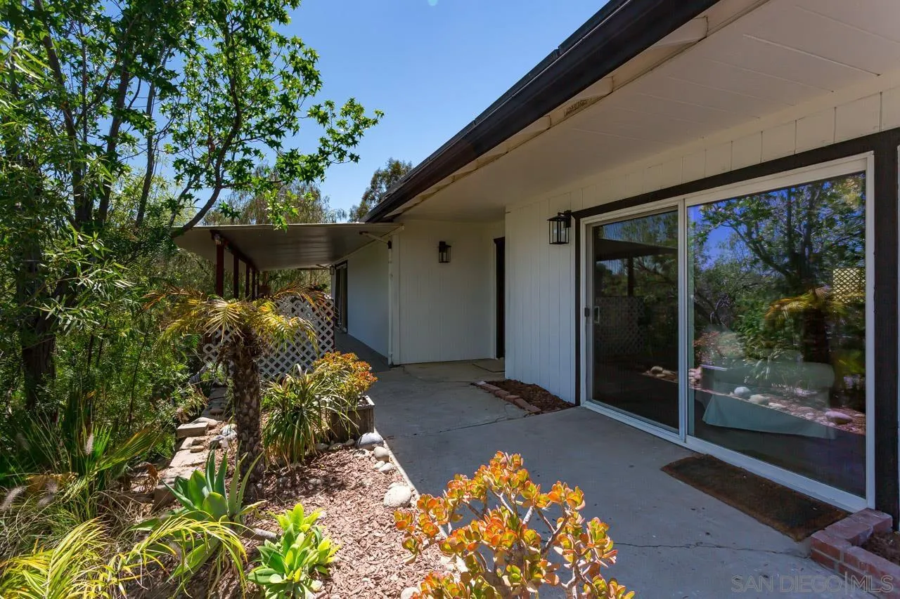 11834 Rocoso Road Lakeside, CA 92040 - Photo 9 of 28 a front view of a house with garden