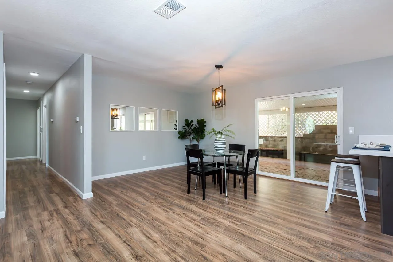 11834 Rocoso Road Lakeside, CA 92040 - Photo 10 of 28 a view of a dining room with furniture and wooden floor