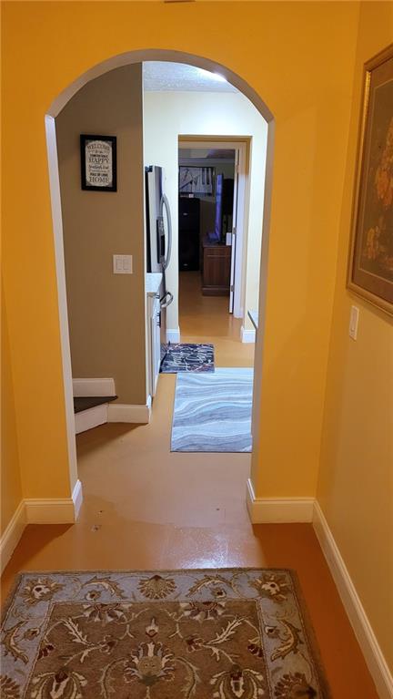 2750 Wellington Way Southeast Conyers, GA 30013 - Photo 4 of 10 a view of a hallway with wooden floor and a cabinet