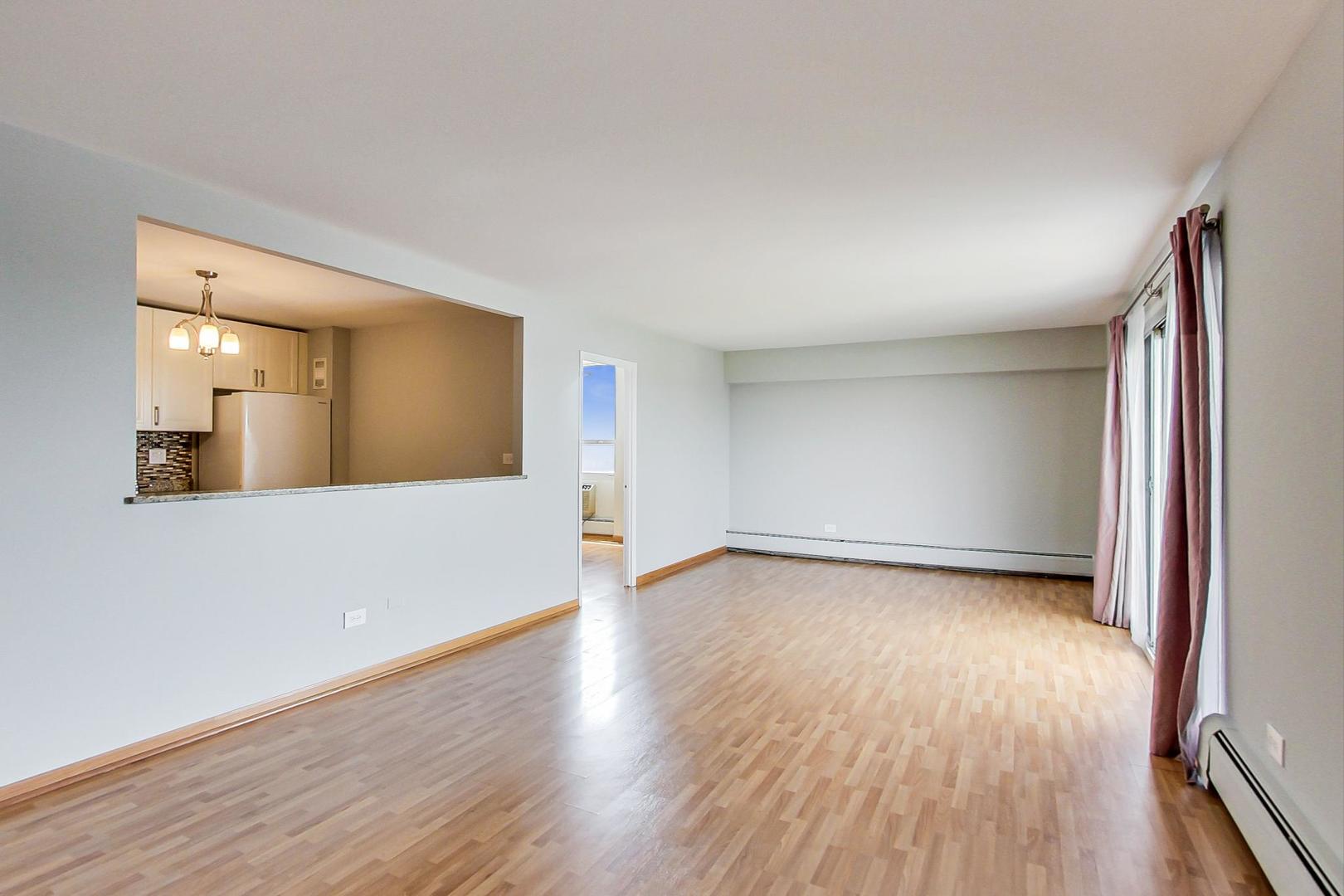 9009 Golf Road, Unit 8B Des Plaines, IL 60016 - Photo 14 of 42 a view of a room with wooden floors and bathroom