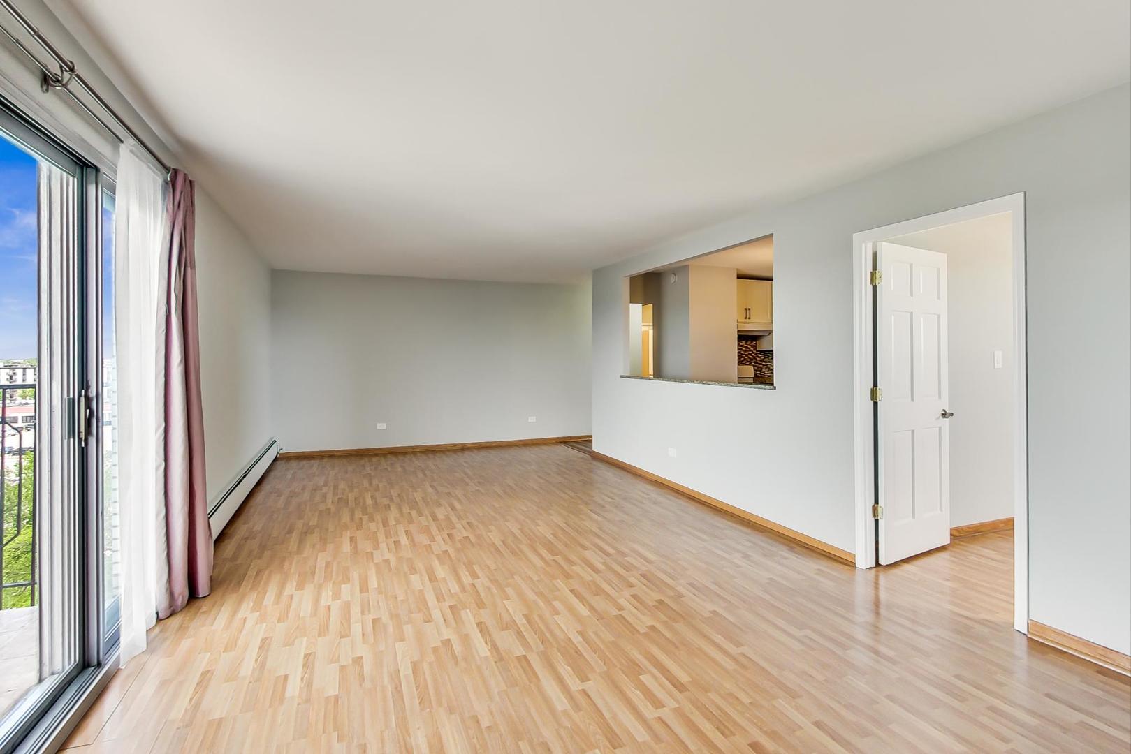 9009 Golf Road, Unit 8B Des Plaines, IL 60016 - Photo 15 of 42 a view of a room with wooden floor and window