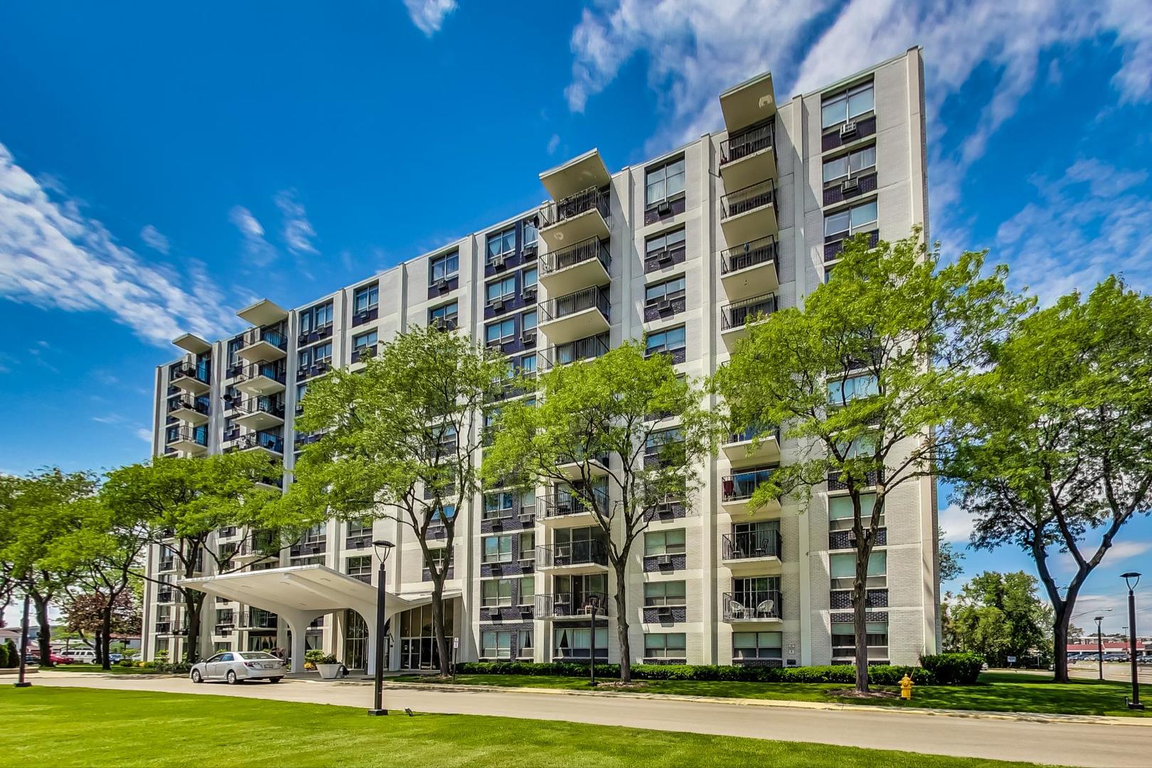 9009 Golf Road, Unit 8B Des Plaines, IL 60016 - Photo 3 of 42 a front view of a building with garden