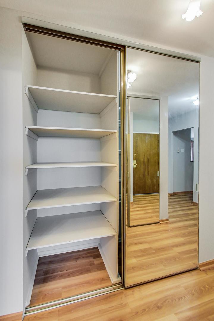 9009 Golf Road, Unit 8B Des Plaines, IL 60016 - Photo 31 of 42 a view of walk in closet with empty racks