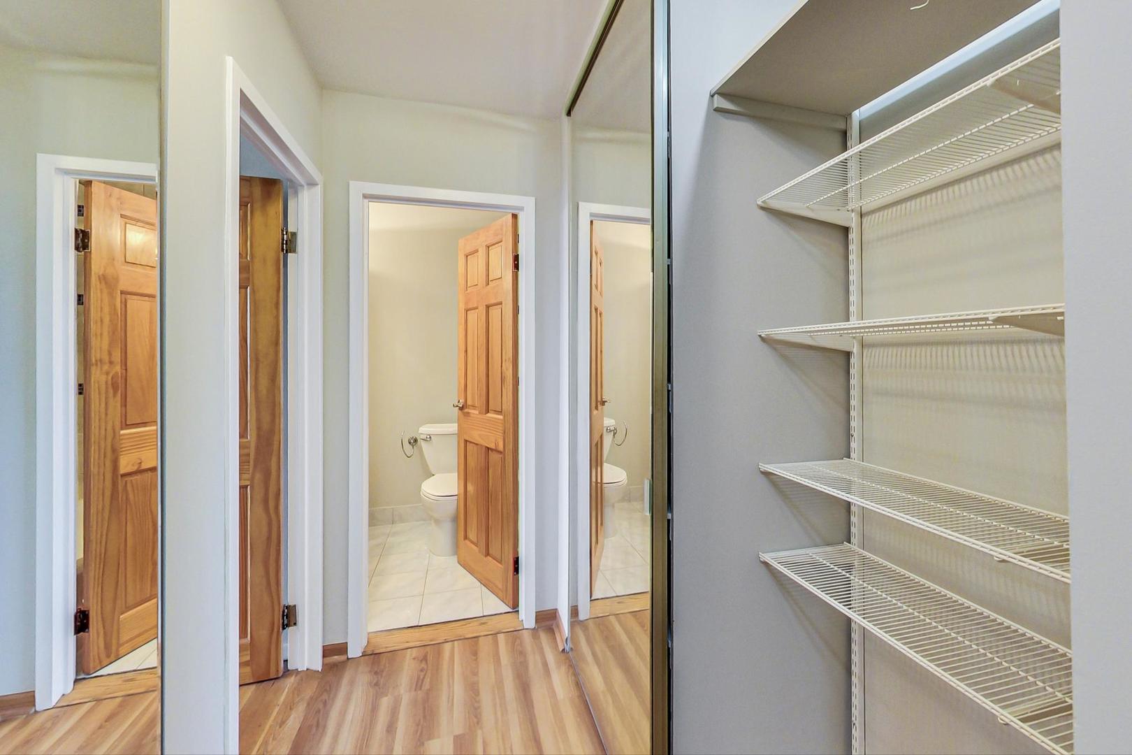 9009 Golf Road, Unit 8B Des Plaines, IL 60016 - Photo 32 of 42 a view of a room with wooden floor and windows
