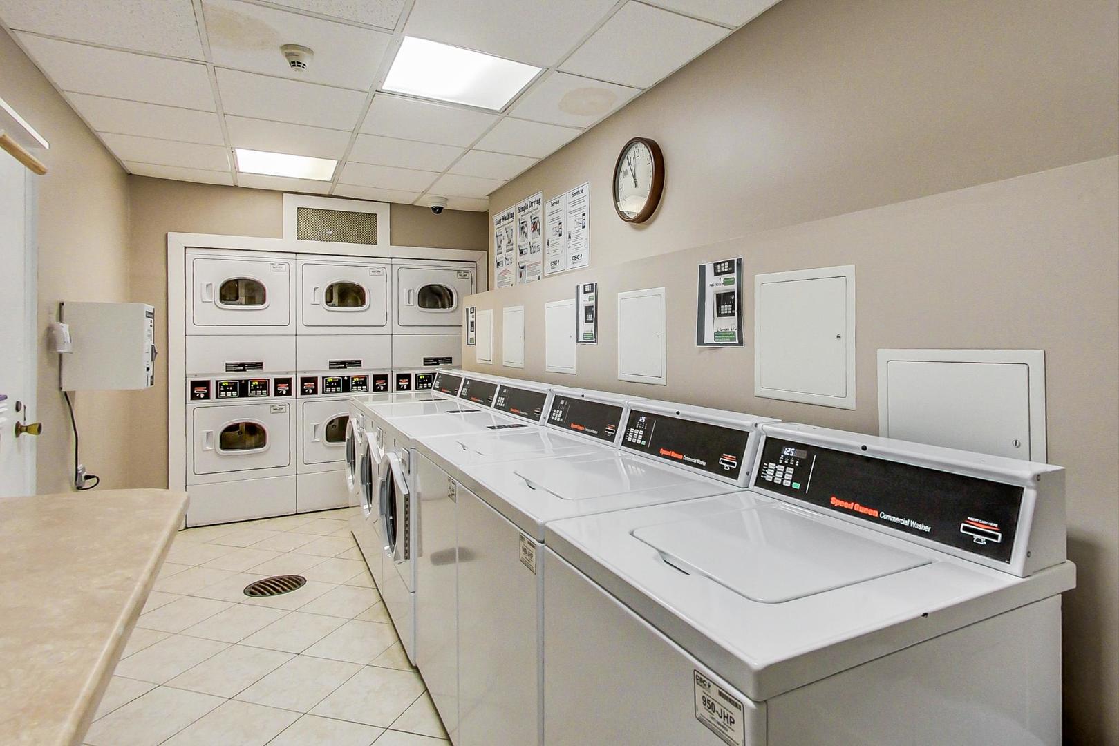 9009 Golf Road, Unit 8B Des Plaines, IL 60016 - Photo 35 of 42 a utility room with stainless steel appliances lots of counter space and sink