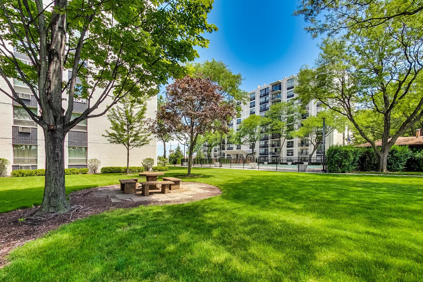 9009 Golf Road, Unit 8B Des Plaines, IL 60016 - Photo 39 of 42 a garden with trees in the background