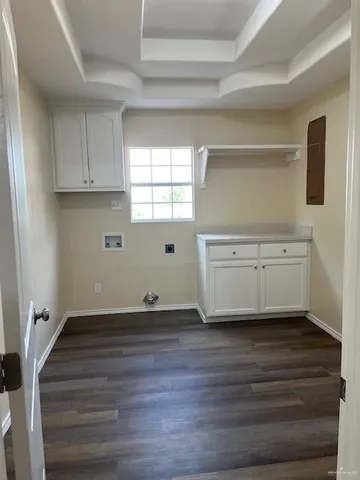 a view of cabinets and wooden floor