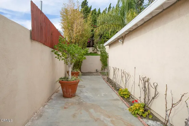 a view of a porch with potted plants