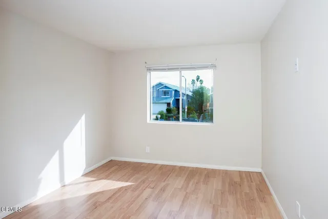 an empty room that has a window